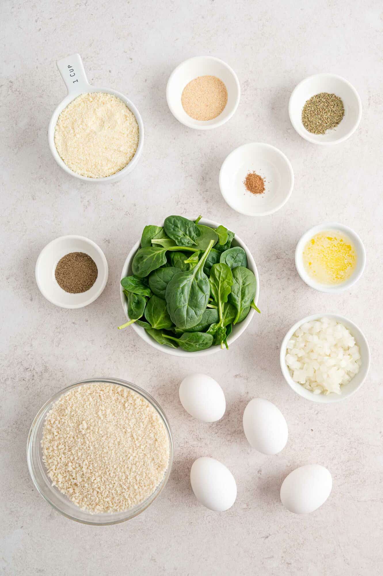 Spinach balls are great served hot from the oven or air fryer, or at room temperature, making them a perfect appetizer for any season! The ingredients for easy spinach balls.