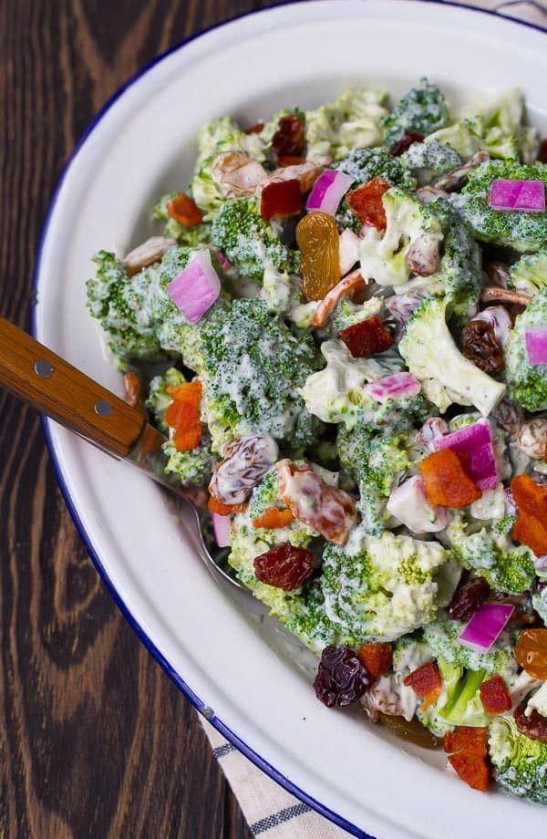 A deli classic, made easier on the waistline! You'll love this healthy broccoli salad, it's an absolute crowd pleaser at any barbecue. And don't worry, it still has bacon! Get the easy salad recipe on RachelCooks.com!