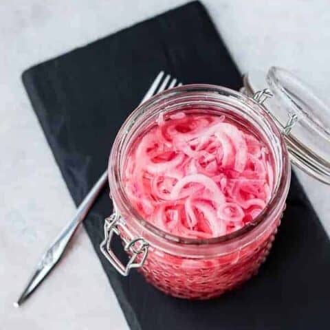 Learning how to pickle red onions is SO easy - it only takes five minutes! You'll love having a jar in your fridge for tacos, avocado toast, and more! Get the EASY method on RachelCooks.com!