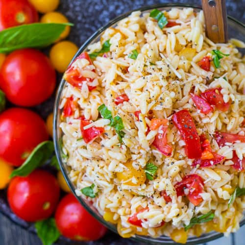 Fresh and flavorful, this bruschetta orzo pasta salad is going to be a summertime favorite! Bonus: No mayo or yogurt so it's great for warm-weather picnics. Get the easy summer pasta salad recipe on RachelCooks.com!