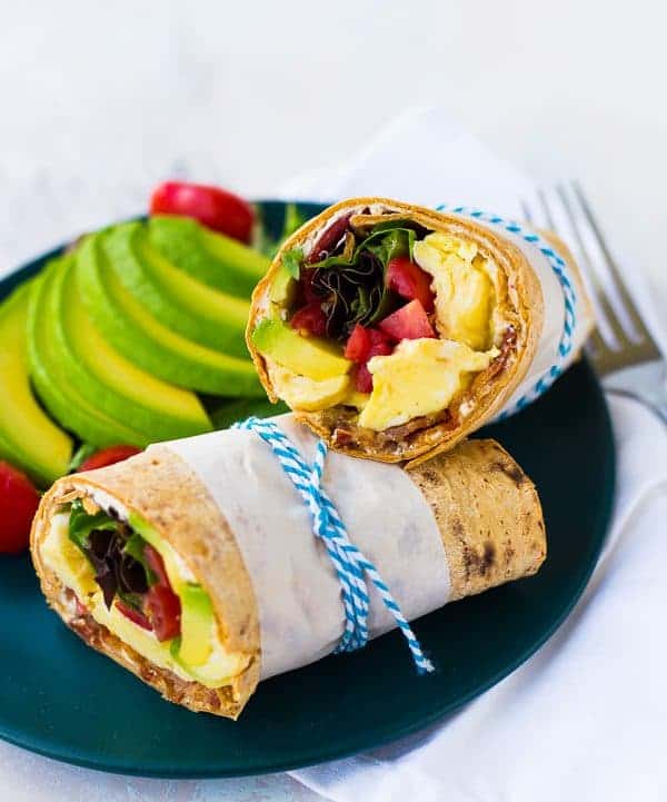 This California Breakfast Wrap is great for breakfast or lunch! The salty bacon, creamy avocado, fresh tomatoes and filling eggs make it a perfect meal! Get the easy recipe on RachelCooks.com!