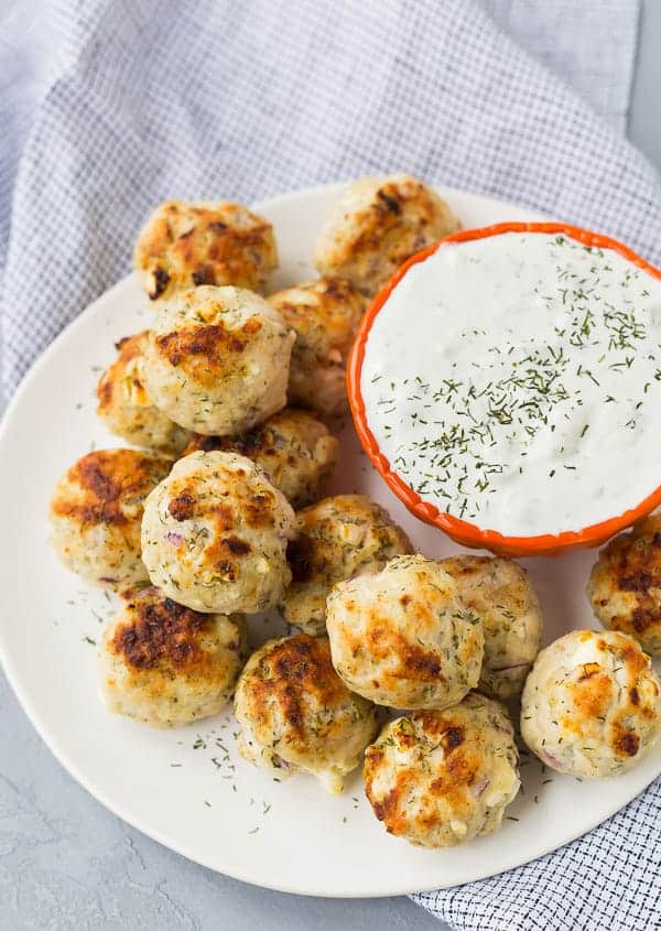 Overhead of meatballs on plate with sauce.