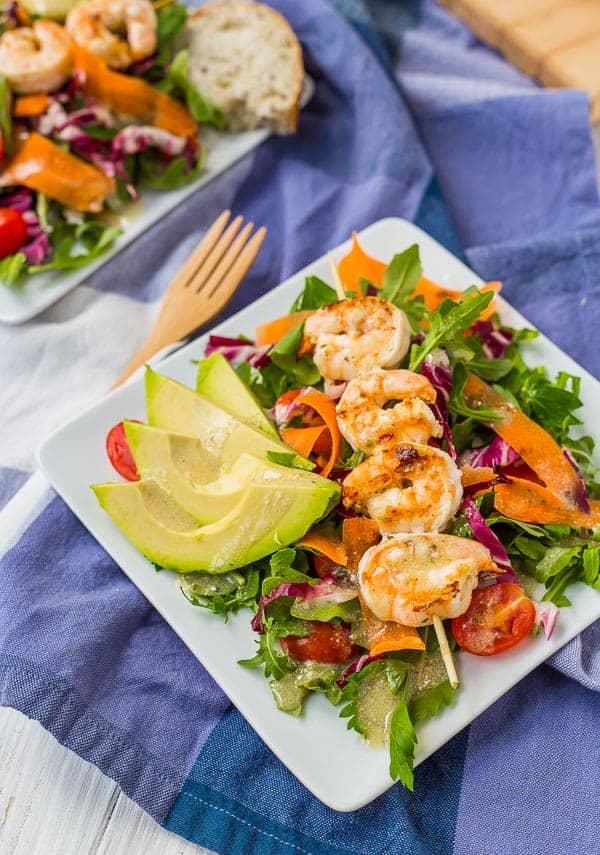 Grilled shrimp salad on plate.
