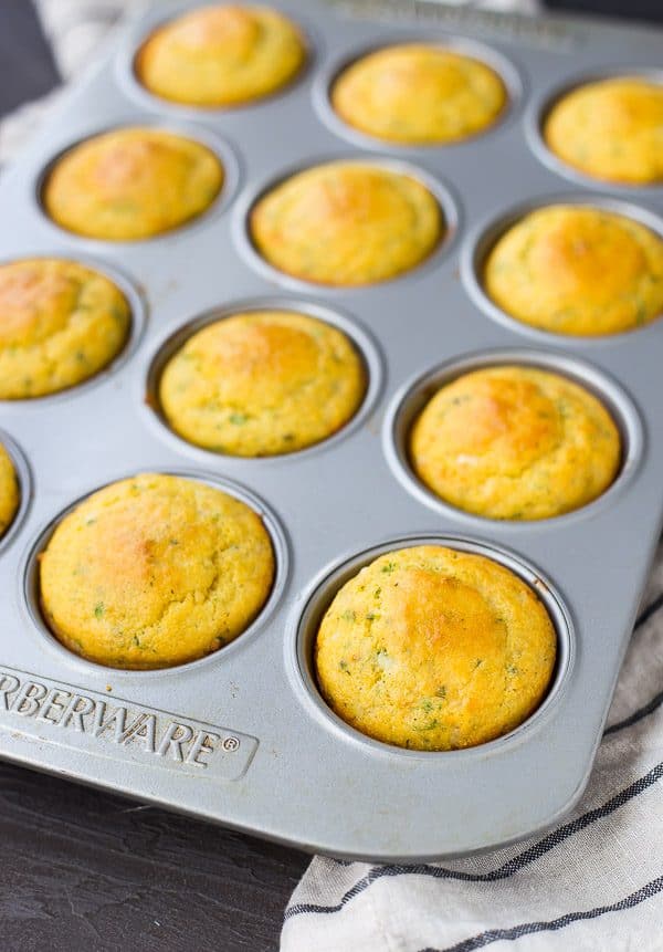 This Cornbread Muffin Recipe with Herbs and Cheddar takes your standard corn muffins up a notch thanks to flavorful herbs and rich, sharp cheddar. They're perfect with a bowl of chili! Get the easy muffin recipe on RachelCooks.com!