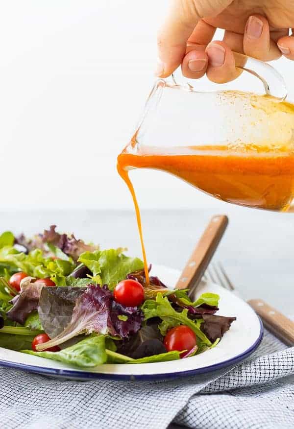 Sweetened and flavored with carrot juice, this vinaigrette salad dressing is free of added sugars but not short on flavor! It's great on salads with southwestern toppings! Get the recipe on RachelCooks.com!