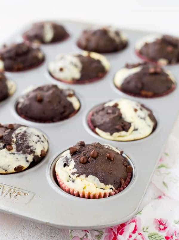 Can you think of a better way to start your day than with a decadent chocolate muffin with ribbons of cream cheese running through it? These chocolate cream cheese muffins make for happy, happy mornings! Get the recipe on RachelCooks.com!