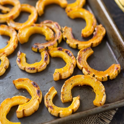 Learn how to cook delicata squash with this easy roasting method! Spoiler alert: No peeling necessary!  Get the easy method on RachelCooks.com!