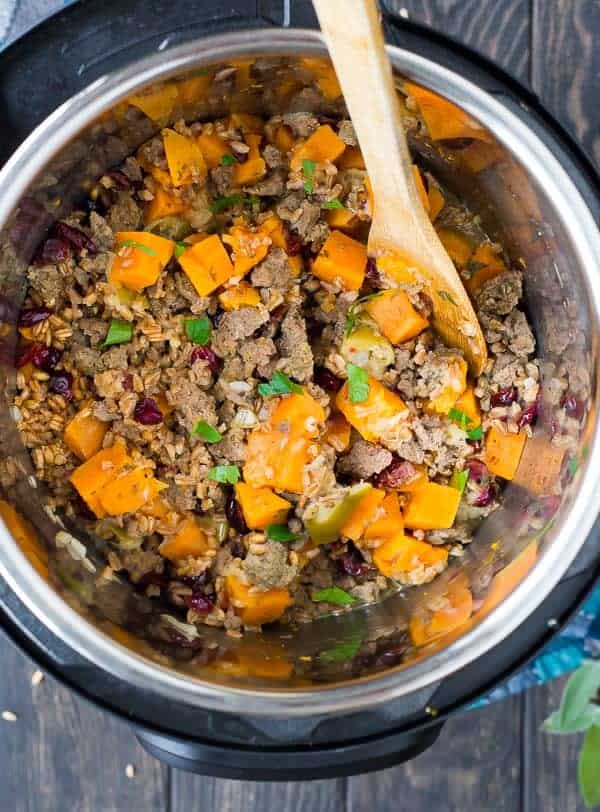Great any day as a complete meal, or as a Thanksgiving side, this Instant Pot Farro Stuffing with Sausage and Sweet Potatoes is flavorful, warm and filling. - Get the easy pressure cooker recipe on RachelCooks.com