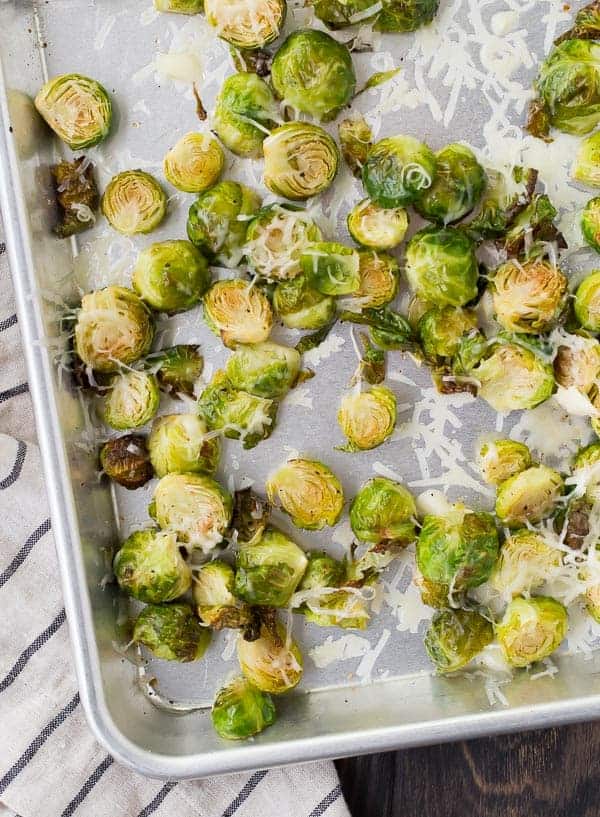 Overhead of roasted Brussels sprouts on sheet pan.