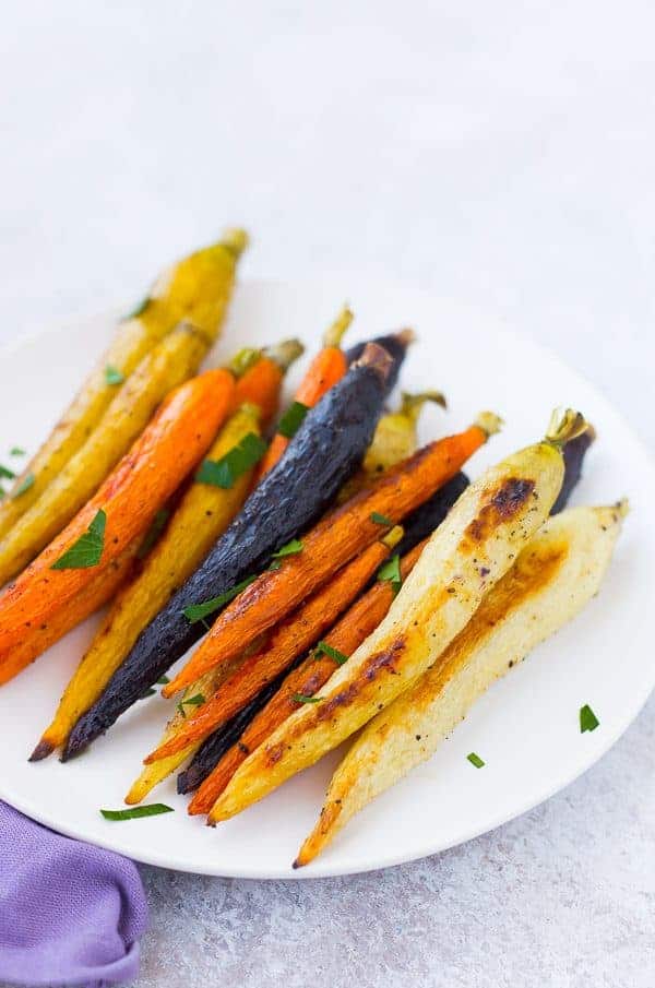 Roasted whole carrots not only offer a stunningly gorgeous presentation, but also come with the bonus that you don't need to chop anything! Get the easy method on RachelCooks.com!