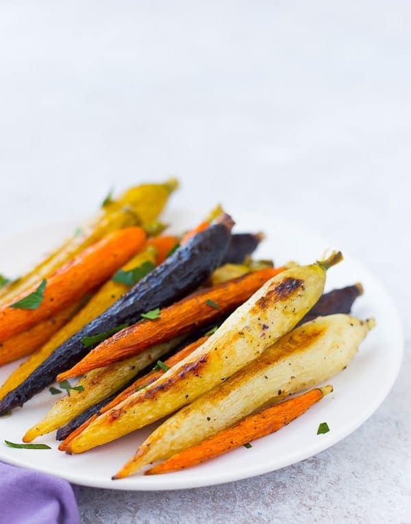 Roasted whole carrots not only offer a stunningly gorgeous presentation, but also come with the bonus that you don't need to chop anything! Get the easy method on RachelCooks.com!