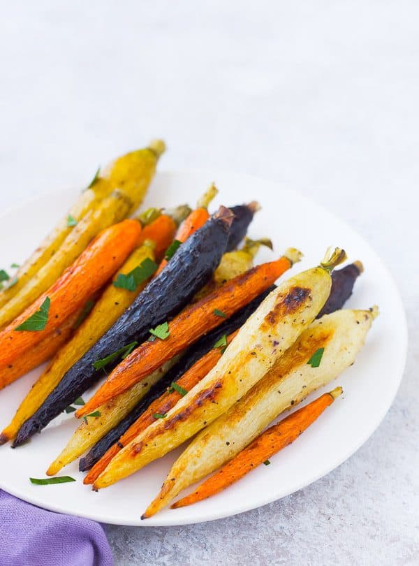 Roasted whole carrots not only offer a stunningly gorgeous presentation, but also come with the bonus that you don't need to chop anything! Get the easy method on RachelCooks.com!