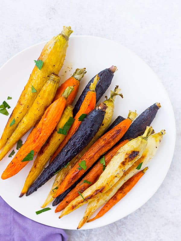 Roasted whole carrots not only offer a stunningly gorgeous presentation, but also come with the bonus that you don't need to chop anything! Get the easy method on RachelCooks.com!