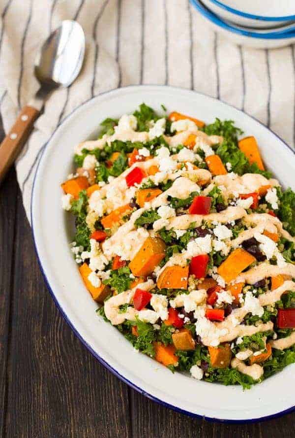 Filling and flavorful, this kale sweet potato salad is filled with southwestern flavors and nutritious ingredients! It's great for meal prepping and healthy eating all week long. Get the recipe on RachelCooks.com!