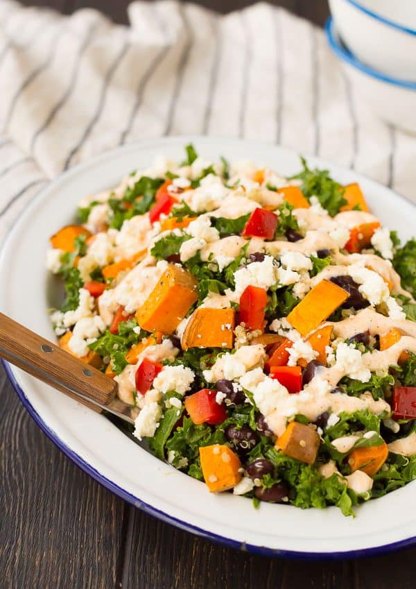 Filling and flavorful, this kale sweet potato salad is filled with southwestern flavors and nutritious ingredients! It's great for meal prepping and healthy eating all week long. Get the recipe on RachelCooks.com!