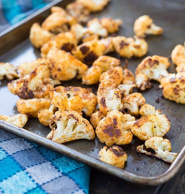 Roasted Cauliflower with Chili Powder is absolutely perfect on its own but it's also an ideal addition to salads and burrito bowls. You might even find yourself reaching for the chili powder every time you roast cauliflower! Get the recipe on RachelCooks.com!
