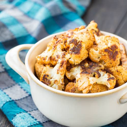 Roasted Cauliflower with Chili Powder is absolutely perfect on its own but it's also an ideal addition to salads and burrito bowls. You might even find yourself reaching for the chili powder every time you roast cauliflower! Get the recipe on RachelCooks.com!