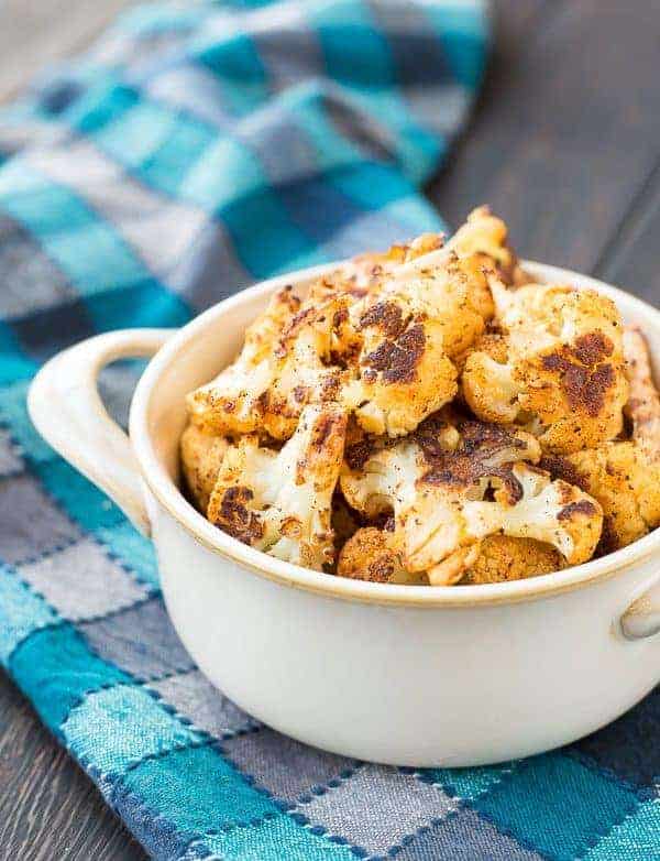 Roasted Cauliflower with Chili Powder is absolutely perfect on its own but it's also an ideal addition to salads and burrito bowls. You might even find yourself reaching for the chili powder every time you roast cauliflower! Get the recipe on RachelCooks.com!