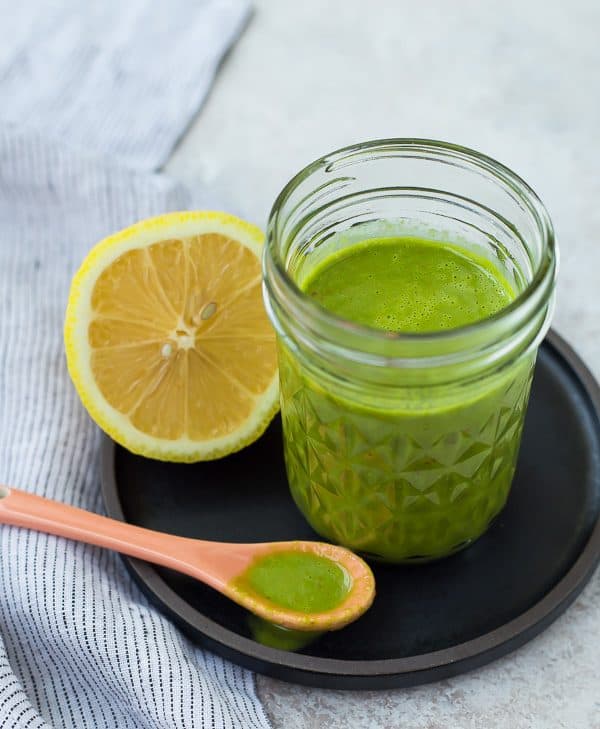 Bright and fragrant, this lemon basil vinaigrette dressing is the perfect healthy salad dressing. It's Whole30 compliant and is a great addition to a green tossed salad or a pasta salad. It's also great drizzled on top of grilled chicken! Get the easy salad dressing recipe on RachelCooks.com!