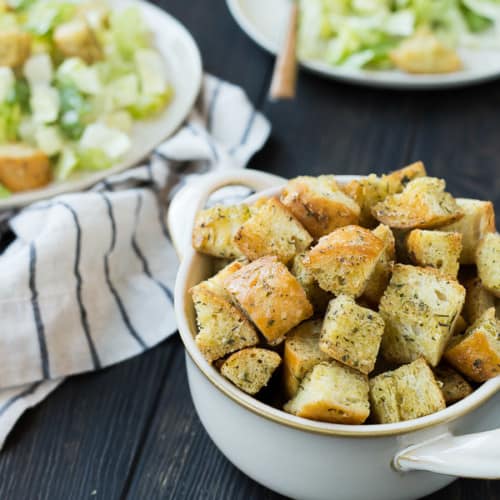 Caesar Croutons are the crowning jewel on a classic Caesar Salad and once you make this homemade version, you'll find yourself wondering why you ever bought croutons from the store. There is no comparison and they'll quickly take your Caesar Salad game to the next level. Get the recipe on RachelCooks.com!