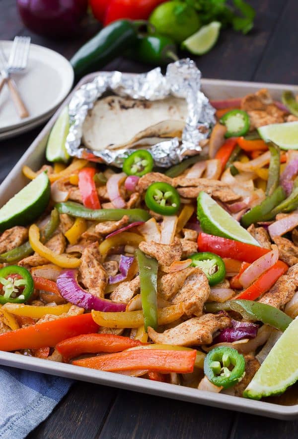 Closeup of sheet pan fajitas on sheet pan.