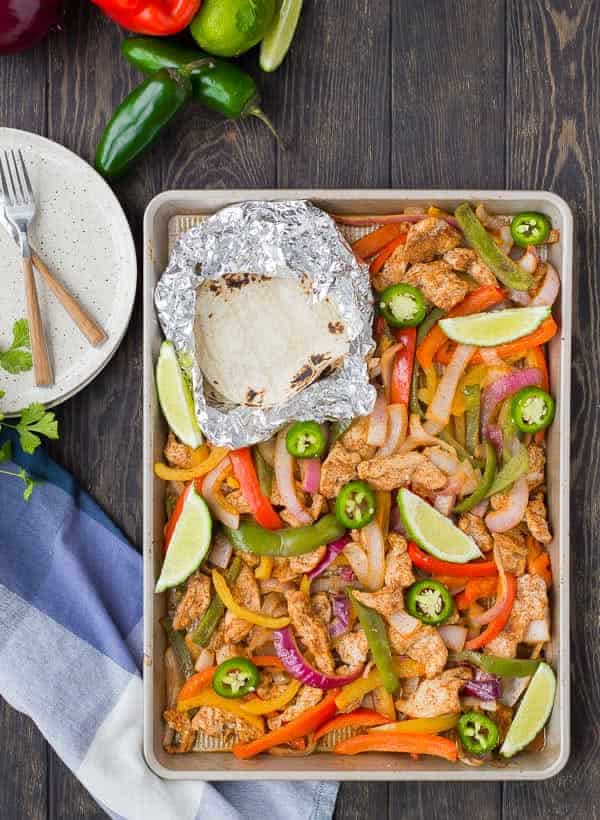 Sheet pan fajitas are great for busy weeknights and also great for bigger crowds! You'll love this easy, hands-off approach to fajitas! This recipe is for chicken fajitas but you'll also find tips for steak, vegetarian, and shrimp fajitas! Get the recipe on RachelCooks.com!