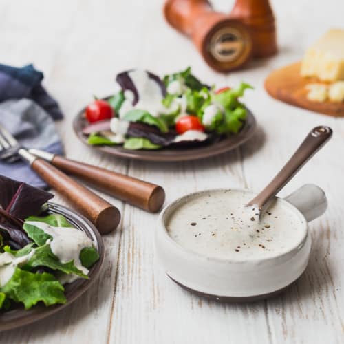 This creamy Parmesan Peppercorn Dressing is the perfect dressing if you love ranch but are looking for something new. It's cheesy with a little spice and it's lightened up with Greek yogurt and buttermilk. You're going to love it!