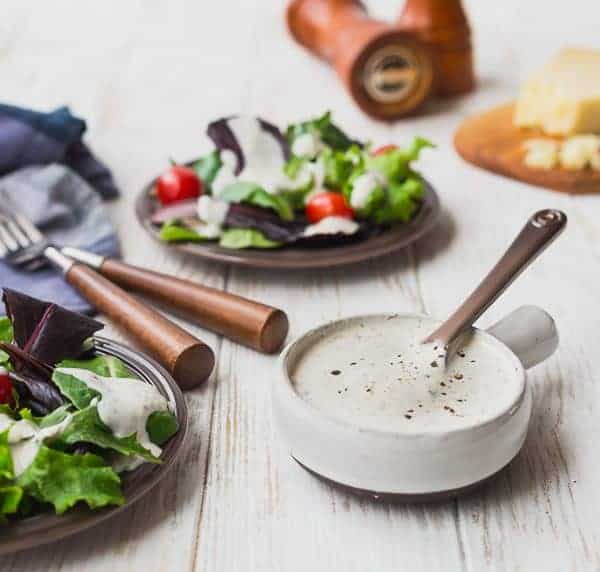 This creamy Parmesan Peppercorn Dressing is the perfect dressing if you love ranch but are looking for something new. It's cheesy with a little spice and it's lightened up with Greek yogurt and buttermilk. You're going to love it!