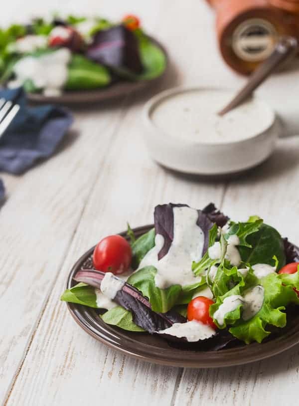 This creamy Parmesan Peppercorn Dressing is the perfect dressing if you love ranch but are looking for something new. It's cheesy with a little spice and it's lightened up with Greek yogurt and buttermilk. You're going to love it!