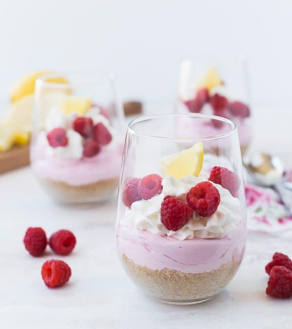 These fun No-Bake Mini Cheesecakes scream springtime with their pink lemonade flavor and sprinkle of fresh raspberries. They're bright and cheerful and SO easy to make! You're going to love them!