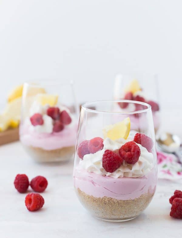 These fun No-Bake Mini Cheesecakes scream springtime with their pink lemonade flavor and sprinkle of fresh raspberries. They're bright and cheerful and SO easy to make! You're going to love them!