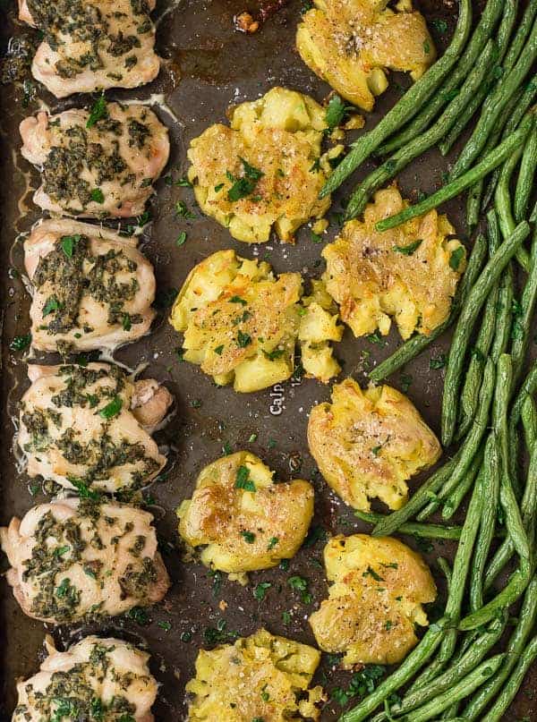 Image of sheet pan dinner with chicken thighs, potatoes, and green beans. Close up photo. 