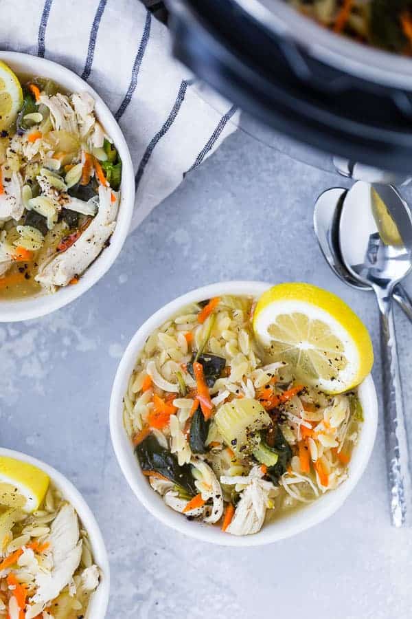 Image of Instant Pot Lemon Chicken Orzo Soup taken from above with spoons