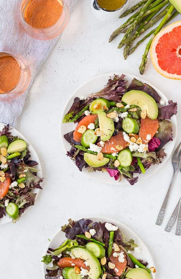 Spring salad with grapefruit, asparagus, cucumber, avocado, feta, almonds, and rosé vinaigrette.