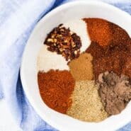 Overhead view of spices in a white bowl.