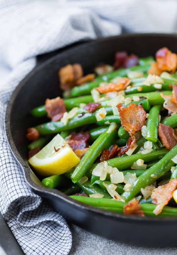A match made in heaven, these green beans with bacon are completely irresistible. They very well might be your new favorite green bean recipe! 
