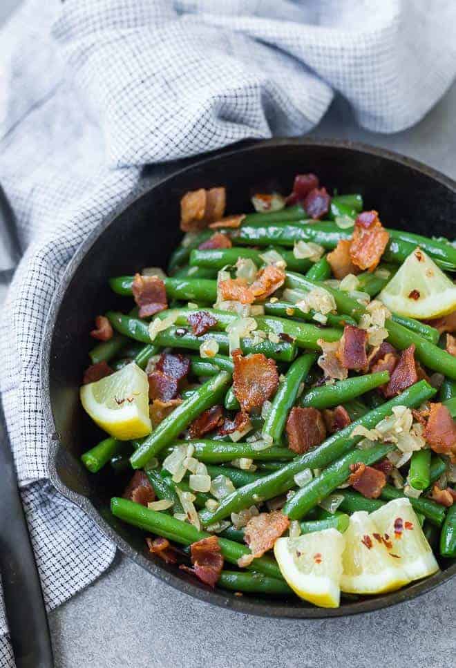 A match made in heaven, these green beans with bacon are completely irresistible. They very well might be your new favorite green bean recipe! 