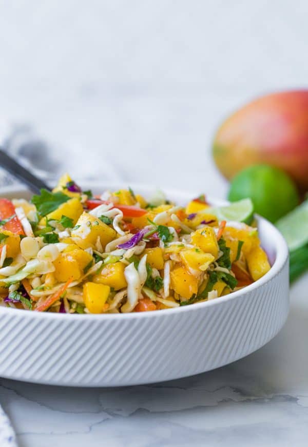 This mango slaw is the perfect slaw for fish tacos, but you'll find yourself eating it all by itself too, because it is that good! 