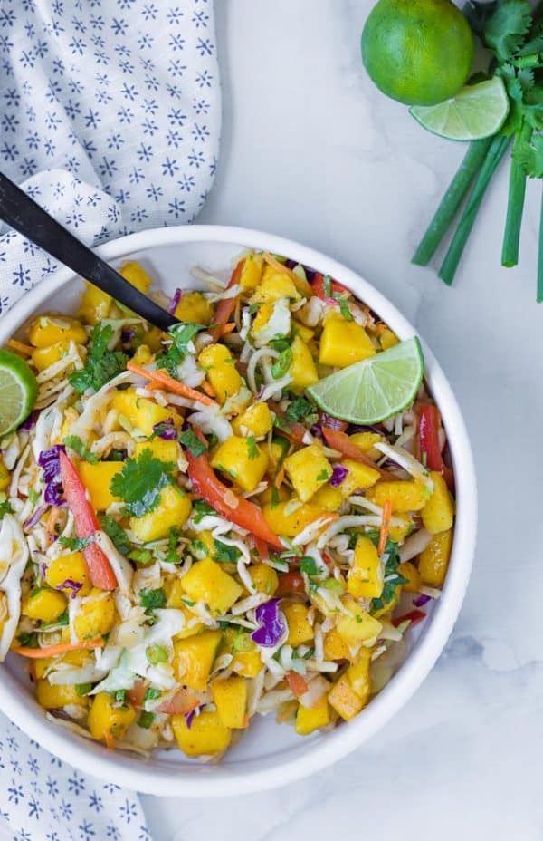 This mango slaw is the perfect slaw for fish tacos, but you'll find yourself eating it all by itself too, because it is that good! 