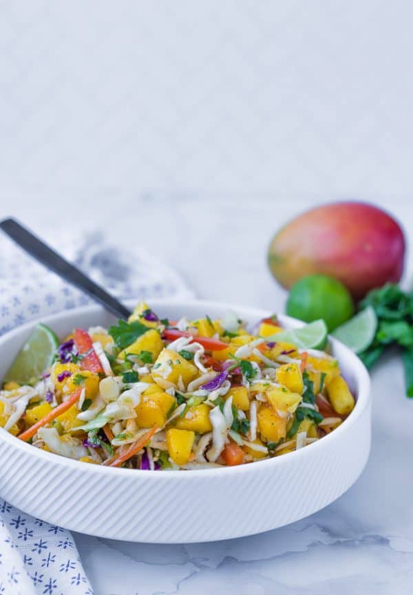 This mango slaw is the perfect slaw for fish tacos, but you'll find yourself eating it all by itself too, because it is that good! 