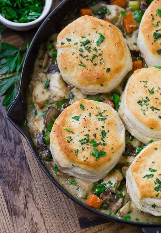 Partial overhead of skillet pot pie, garnished with chopped parsley.