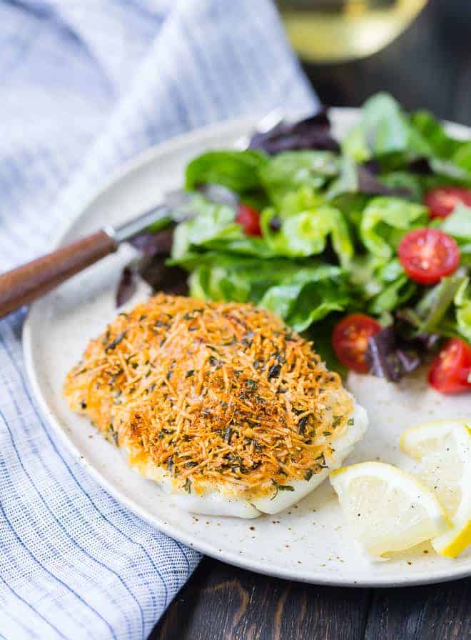 Mild tasting cod encased in a flavorful, crispy crust, this baked cod with lemon and parmesan is a simple and delicious way to add healthy seafood to your weekday menu. High in protein and low in fat, inexpensive cod is a great choice. 