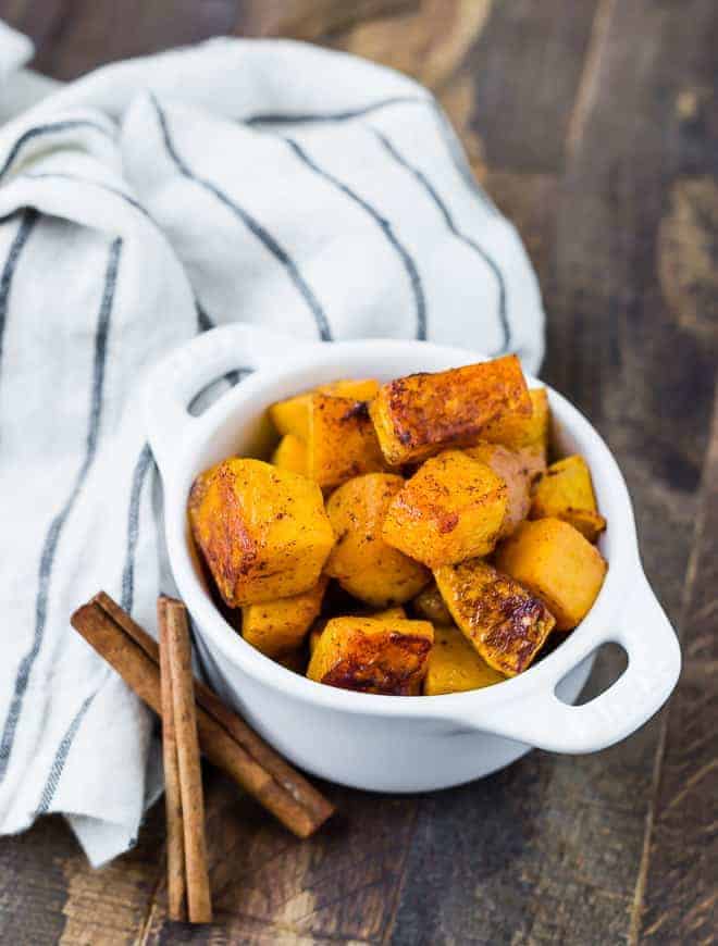 Image of spicy sweet butternut squash in a small white bowl.