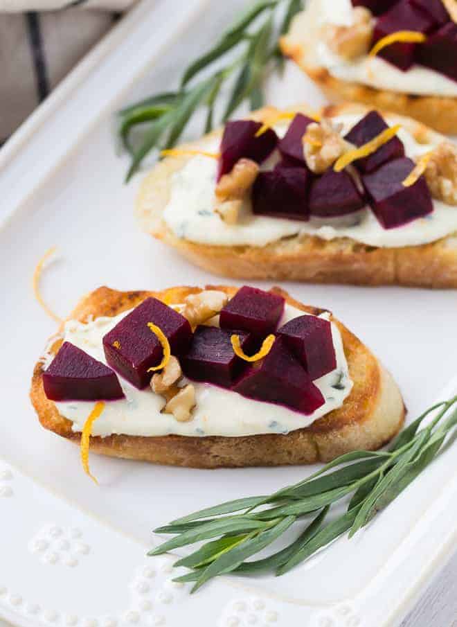 Beet crostini, garnished with tarragon.