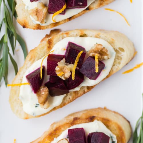 overhead photograph of beets and goat cheese on crostini