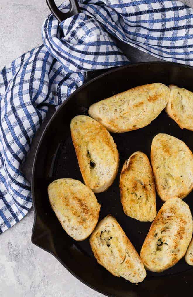 Image of freshly toasted crostini in a frying pan.