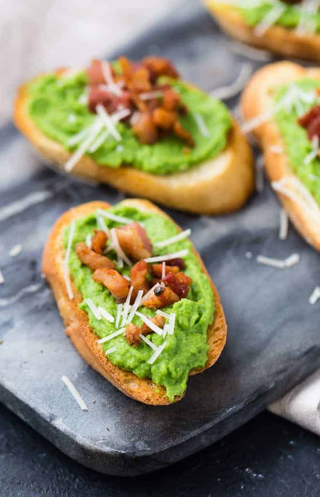 Image of pureed peas on top of crostini. 