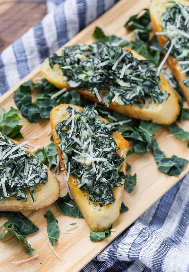 Reminiscent of spinach dip, creamy kale bruschetta will knock your socks off. Crisp bread topped with warm, creamy sautéed kale, enhanced by a hint of garlic and nutmeg, make this appetizer irresistible. 