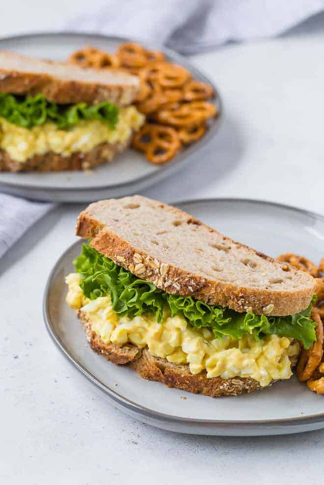 Image of a healthy, hearty egg salad sandwich on a plate.
