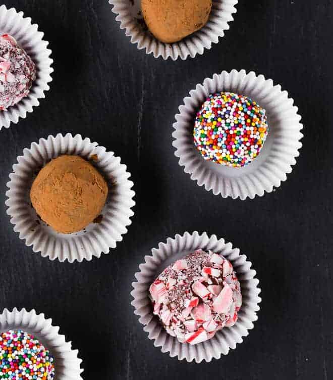 Closeup overhead of several brigadeiros. 